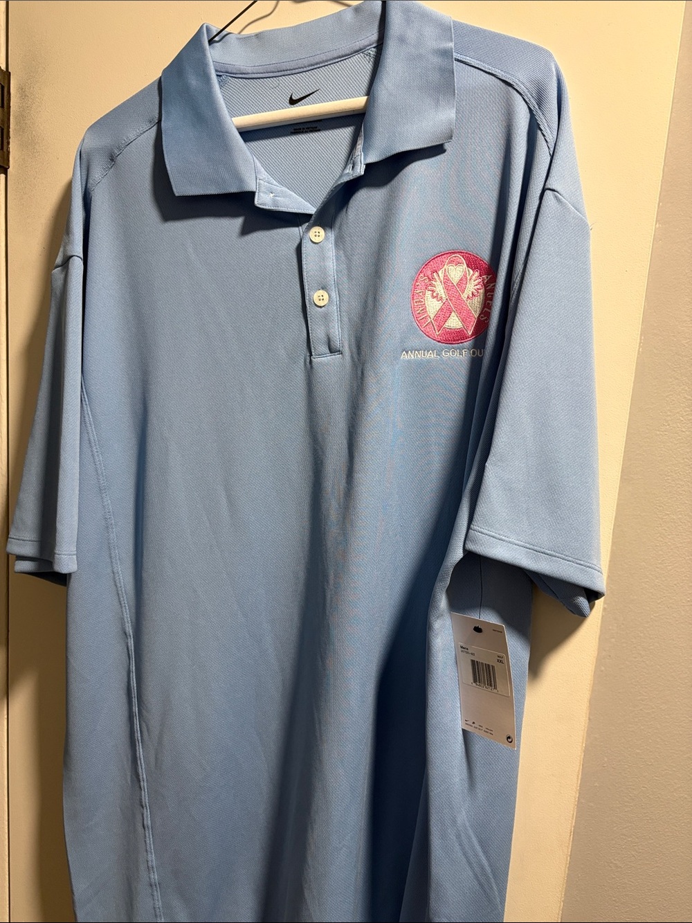 Nike Light Blue Men’s Polo with Pink Emblem